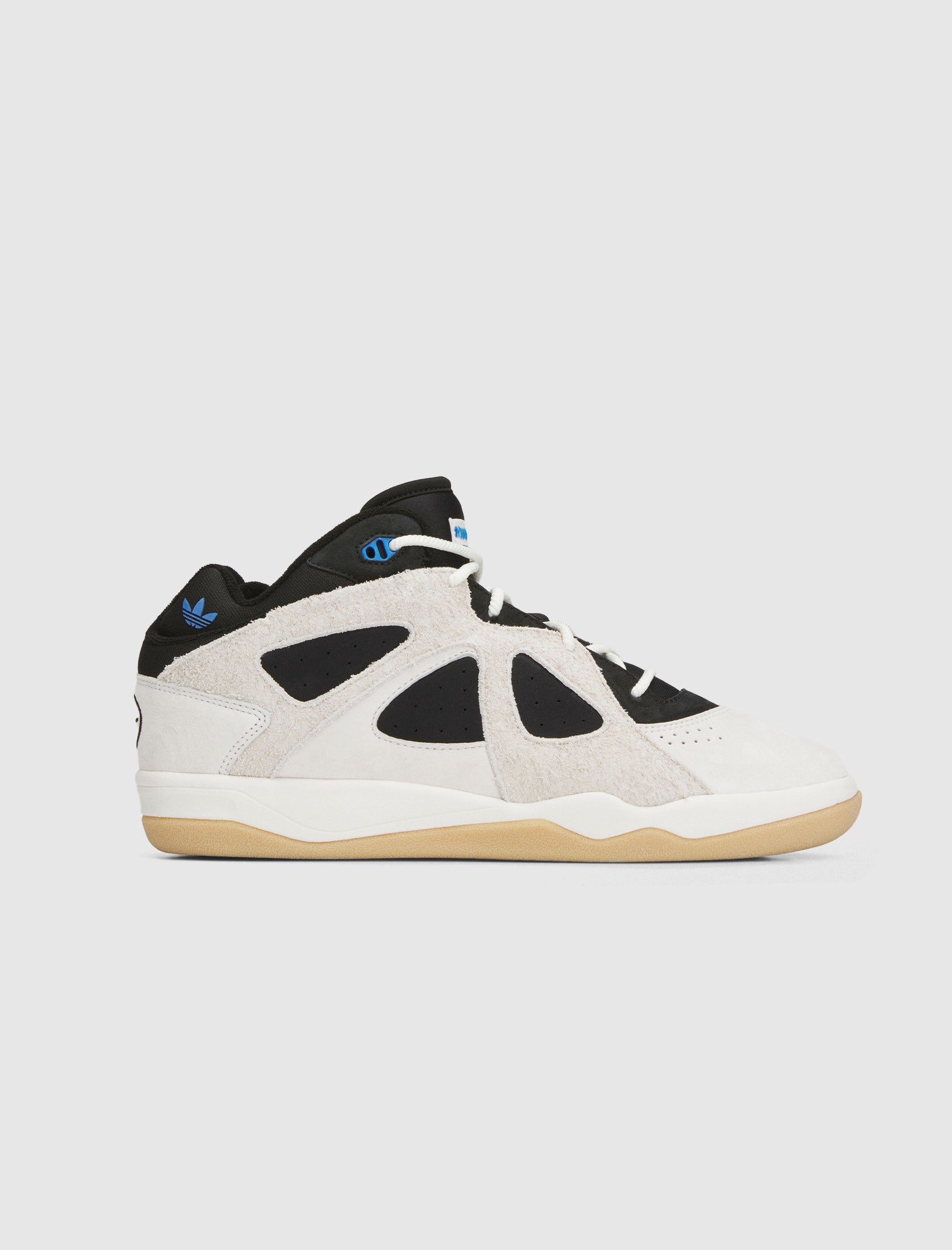The BADBO 1.0 "OFF WHITE/BLACK/GUM" is a white and black low-top sneaker with a suede upper, beige overlays, gum outsole, blue Adidas heel logo, black tongue, and white laces, shown on a plain light background.