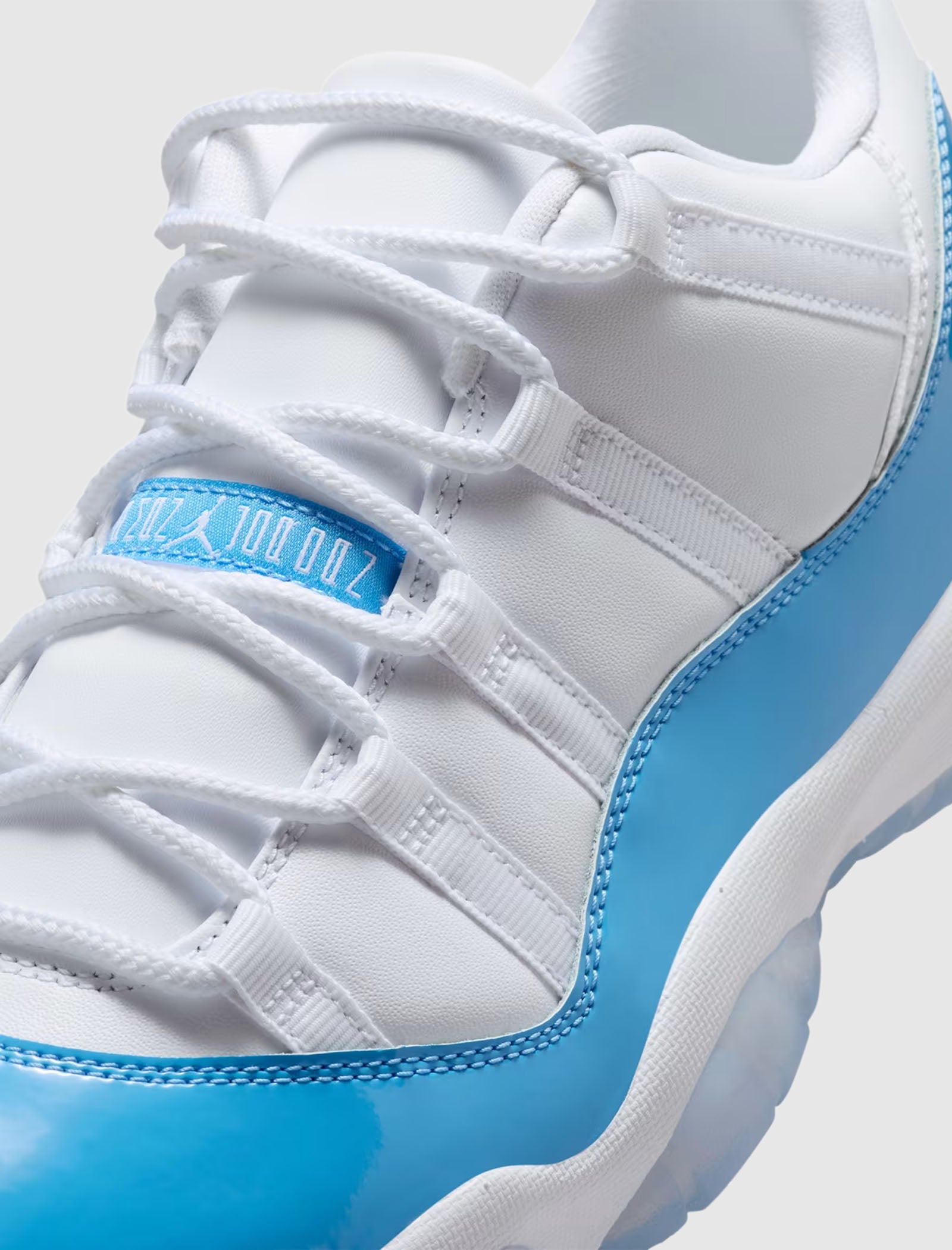 AIR JORDAN 11 RETRO LOW "WHITE/UNIVERSITY BLUE/BLACK"