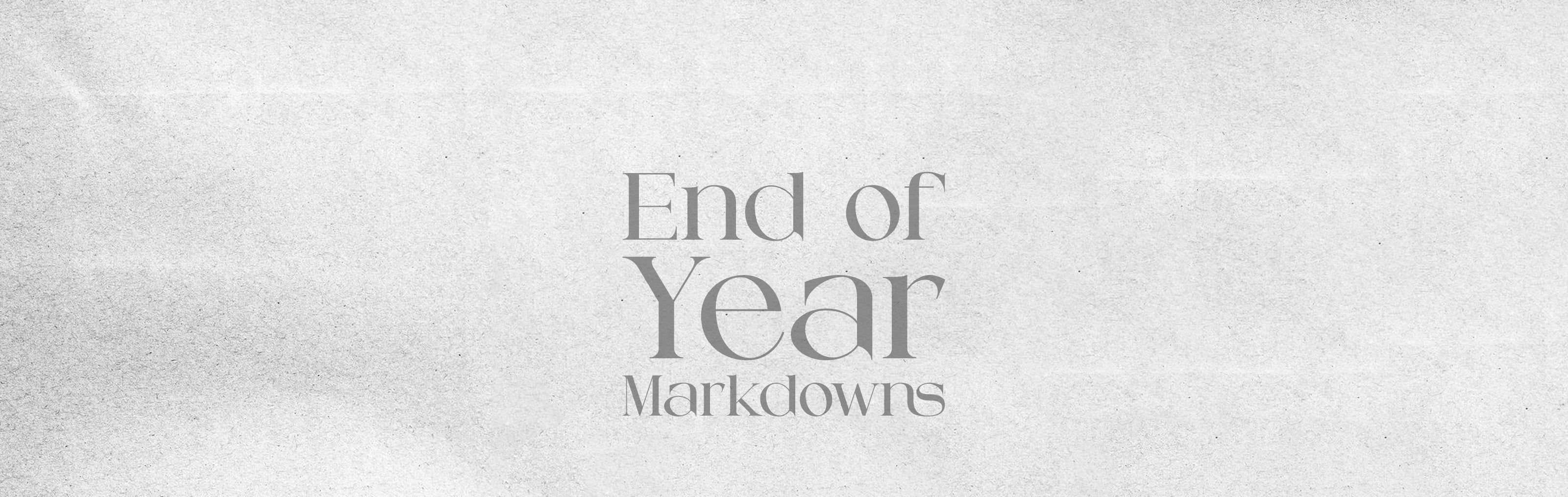 Text 'End of Year Markdowns' on a textured white background
