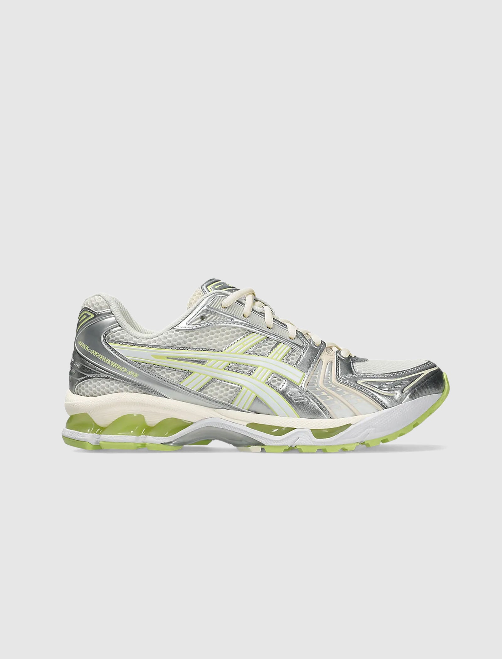 The GEL-KAYANO 14 is a stylish low top sneaker with a metallic silver and light green synthetic upper, cream laces, and a light green sole featuring a gel foam midsole, displayed in profile against a plain light gray background.