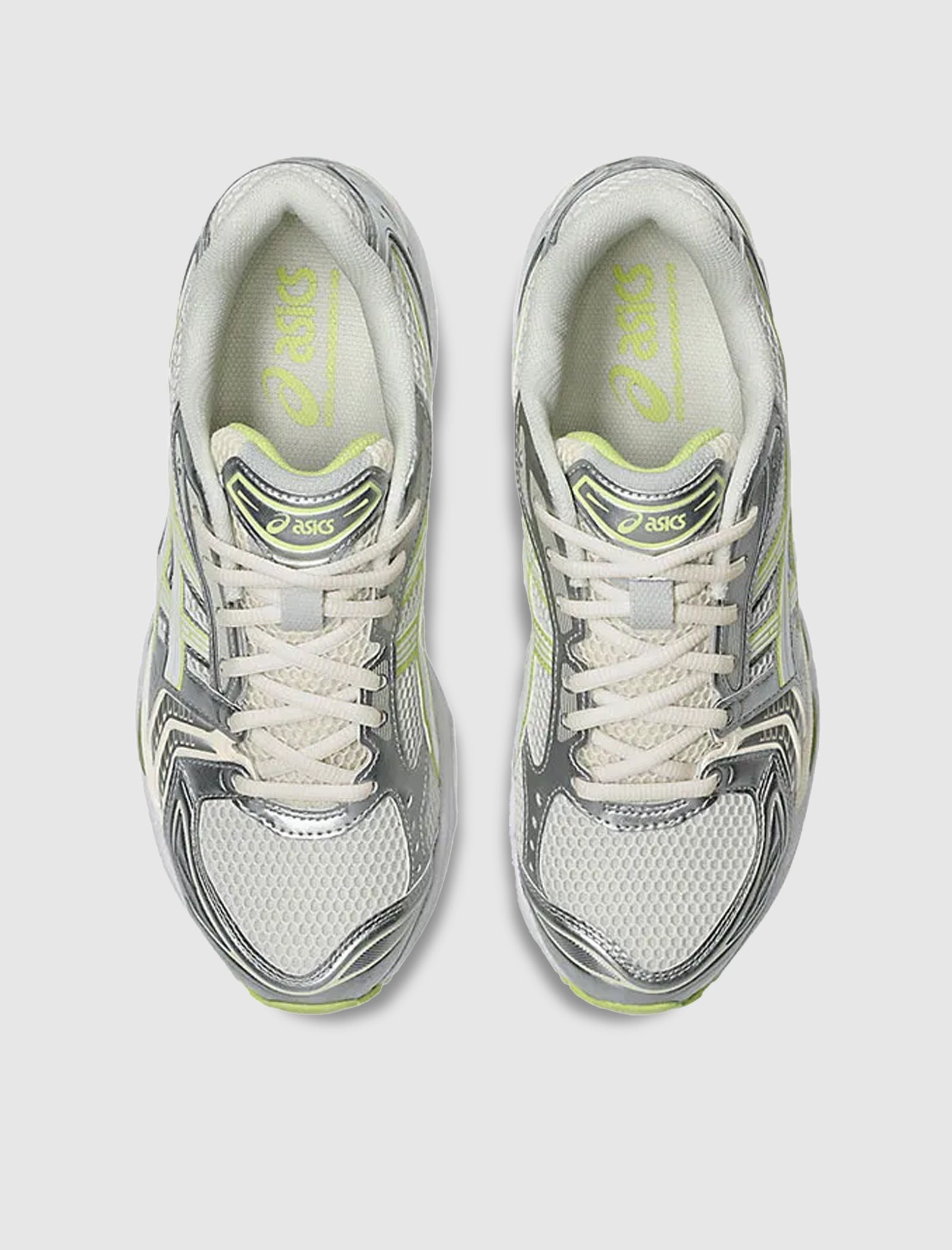 A top-down view of the ASICS GEL-KAYANO 14 low-top sneakers featuring light gray, white, and neon yellow accents, white laces, mesh toe and sides, and a synthetic upper on a gel foam midsole for enhanced comfort.