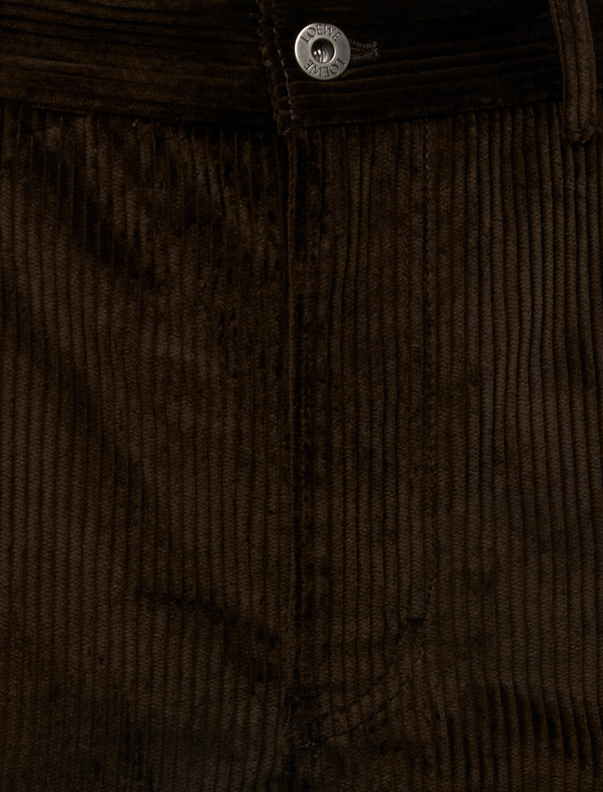 Close-up of brown TROUSERS IN COTTON CORDUROY featuring a silver button at the waist.