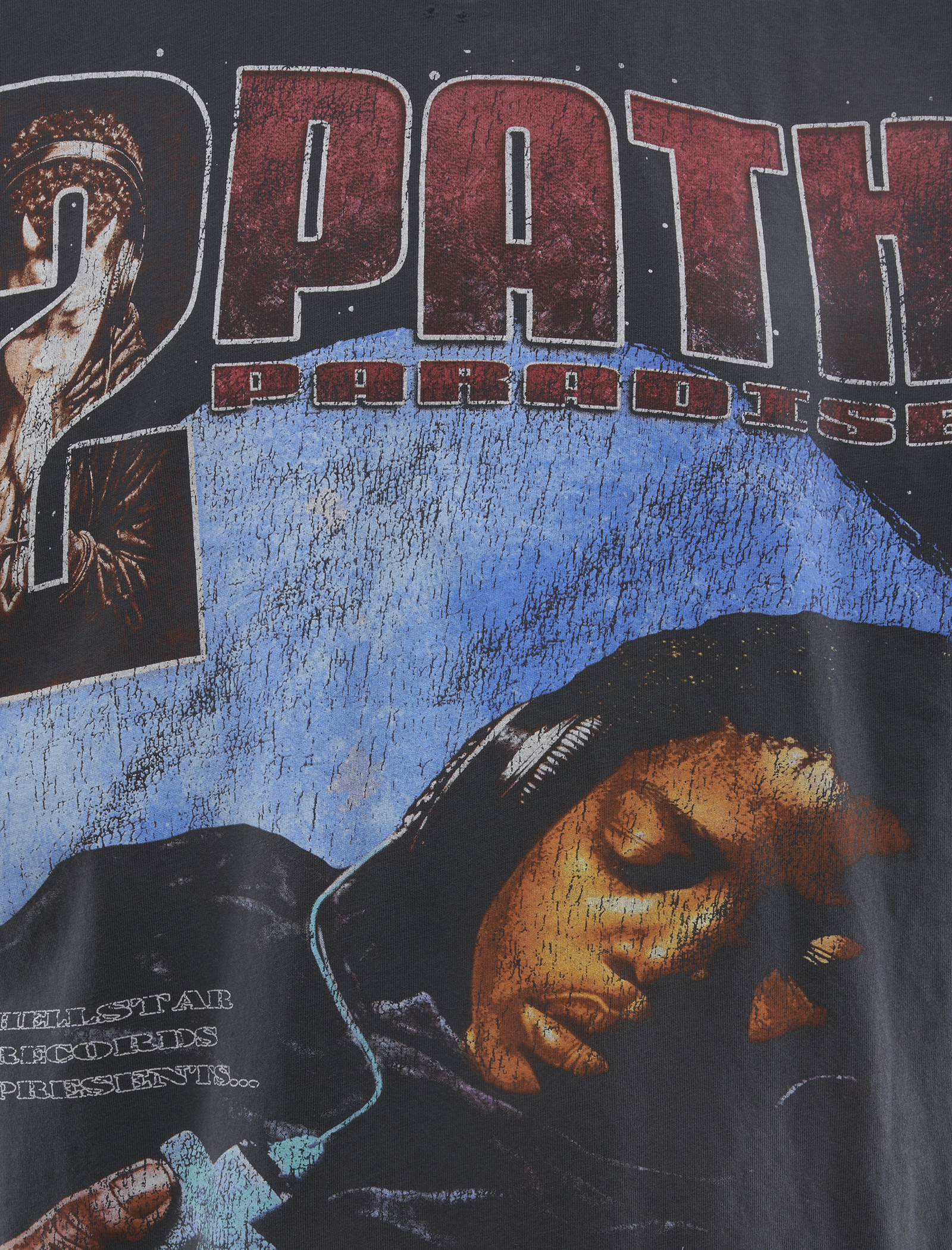 A close-up of the SPIRITUAL INJECTION T-SHIRT, featuring bold 