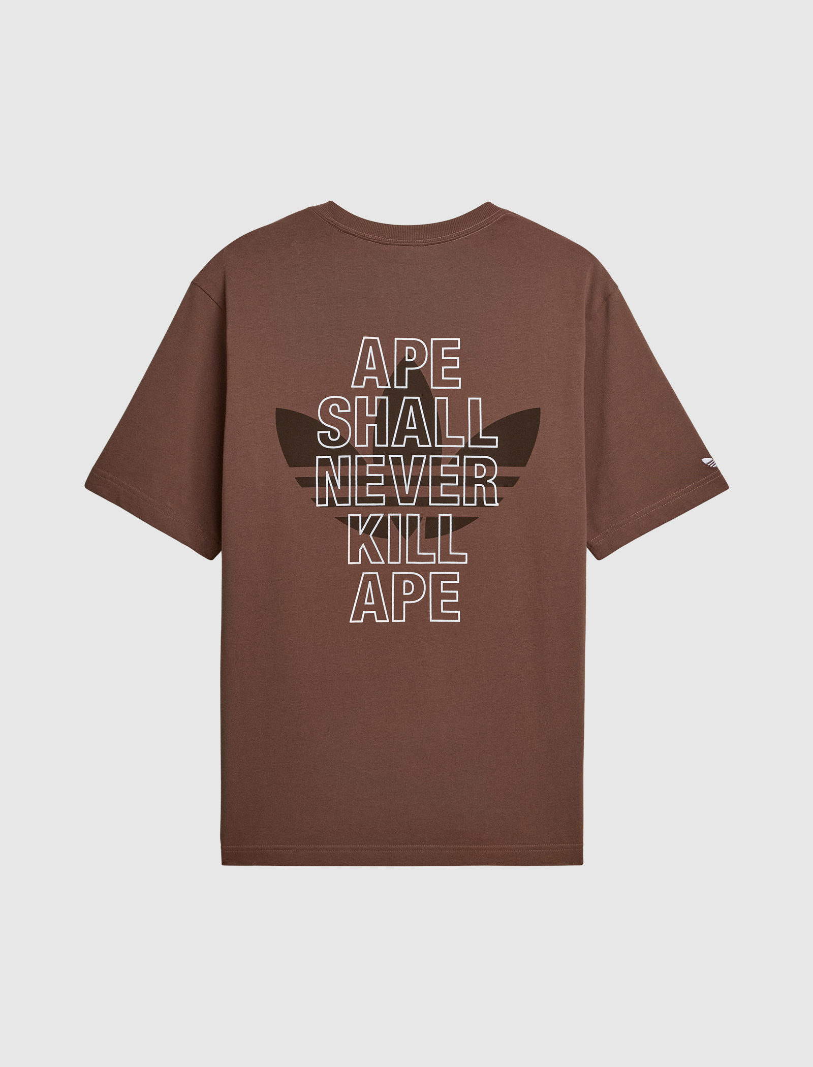 The SSL TEE is a brown shirt with white “APE SHALL NEVER KILL APE” text on the back over a dark brown graphic—perfect for fans of bold logo designs.